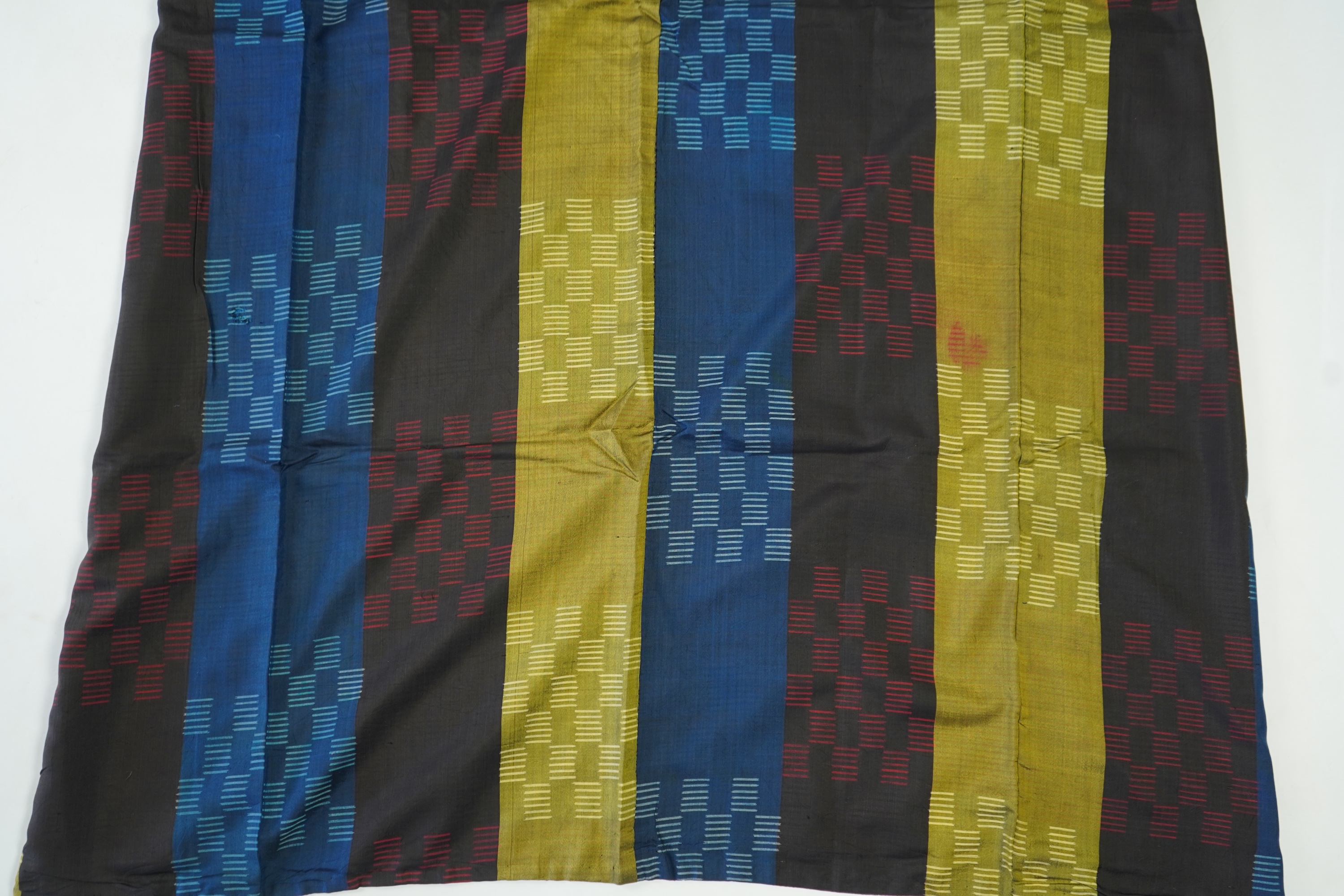 Four 1930’s - 1950’s printed silk full length silk lined Japanese kimonos. Two floral and two geometric in design. Longest black and orange floral designed kimono, 150cm long. Condition - purple and pink check kimono the